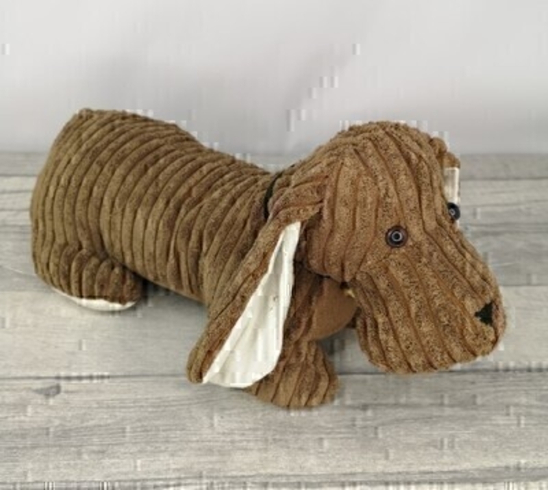 Sausage Dog Doorstop. Perfect for any home. No more slamming doors thanks to this functional doorstop in the shape of a cute dog. They are made from material designed not scratch doors and floors. Functional and decorative piece (Not a toy)